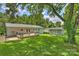 Spacious backyard with deck, shed, and mature trees offering ample outdoor space and storage at 3729 Woodleaf Rd, Charlotte, NC 28205