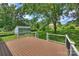 This deck provides backyard views with a shed and lots of green space at 3729 Woodleaf Rd, Charlotte, NC 28205