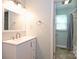 Bathroom features a vanity with modern fixtures and a shower with curtain at 3729 Woodleaf Rd, Charlotte, NC 28205