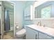 Bathroom showcases tiled floors, modern toilet and shower with curtain at 3729 Woodleaf Rd, Charlotte, NC 28205