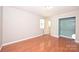 This bedroom showcases hardwood floors, closet and natural light at 3729 Woodleaf Rd, Charlotte, NC 28205