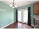 Bright dining area with french doors leading to the outdoor patio at 3729 Woodleaf Rd, Charlotte, NC 28205