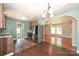 Updated kitchen with stainless steel appliances and modern finishes, connected to the living room at 3729 Woodleaf Rd, Charlotte, NC 28205