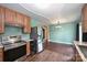 Contemporary kitchen with stainless steel appliances, stylish cabinets, and open layout at 3729 Woodleaf Rd, Charlotte, NC 28205