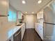 Modern kitchen with white cabinets, stainless steel appliances, and subway tile backsplash at 419 Lige St, Rock Hill, SC 29730