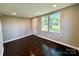 Bright room with hardwood floors, recessed lights, and large windows overlooking the neighborhood at 419 Lige St, Rock Hill, SC 29730