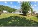 Grassy backyard featuring privacy fence, mature trees and shade, with level ground, with neighbor's homes in view at 4697 Madeline Dr, Rock Hill, SC 29732
