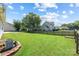 Expansive, well-maintained backyard featuring a privacy fence and lush green grass, great for outdoor activities at 4697 Madeline Dr, Rock Hill, SC 29732