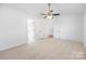 Spacious bedroom featuring neutral carpet, ceiling fan, and closet at 4697 Madeline Dr, Rock Hill, SC 29732
