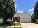 Lovely single-story home with a brick facade, attached garage, and mature trees at 4697 Madeline Dr, Rock Hill, SC 29732