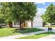 This charming home features mature trees providing shade and curb appeal to the front yard and two car garage at 4697 Madeline Dr, Rock Hill, SC 29732