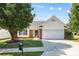Charming single-story home featuring a brick facade, attached garage, and a well-maintained lawn at 4697 Madeline Dr, Rock Hill, SC 29732