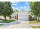 Charming single-story home with brick accents, mature trees, and a well-manicured lawn and a two car garage at 4697 Madeline Dr, Rock Hill, SC 29732