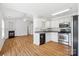Modern kitchen featuring white cabinets, stainless steel appliances, and an open floor plan at 4697 Madeline Dr, Rock Hill, SC 29732