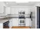 Bright kitchen featuring stainless steel appliances, white cabinets, and updated countertops at 4697 Madeline Dr, Rock Hill, SC 29732