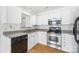 Well-lit kitchen features stainless steel appliances, white cabinetry, and modern fixtures at 4697 Madeline Dr, Rock Hill, SC 29732