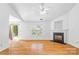 Bright living room features hardwood floors, a fireplace, a ceiling fan, and access to the backyard at 4697 Madeline Dr, Rock Hill, SC 29732