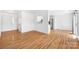 Spacious open-concept floor plan with hardwood floors and views into the kitchen at 4697 Madeline Dr, Rock Hill, SC 29732