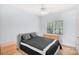 Neutral colored bedroom with ceiling fan, carpet, a black bedspread, and a window at 5238 Downing Creek Dr, Charlotte, NC 28269