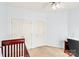 Bright bedroom features carpet floors, ceiling fan, and closet space at 5238 Downing Creek Dr, Charlotte, NC 28269
