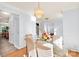 Dining area with hardwood floors and contemporary chandelier at 5238 Downing Creek Dr, Charlotte, NC 28269
