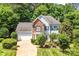 Charming two-story home featuring a well-manicured lawn, brick accents, and a two-car garage at 5238 Downing Creek Dr, Charlotte, NC 28269