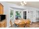 Cozy eat-in kitchen features dining table and a bright window with outdoor view at 5238 Downing Creek Dr, Charlotte, NC 28269