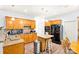 Spacious kitchen features wood cabinets, granite countertops, and stainless steel appliances at 5238 Downing Creek Dr, Charlotte, NC 28269
