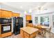 Bright eat-in kitchen features stainless steel appliances and a view of the backyard at 5238 Downing Creek Dr, Charlotte, NC 28269
