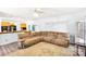 Open-concept living room features a large sectional sofa and hardwood floors at 5238 Downing Creek Dr, Charlotte, NC 28269