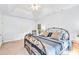 Bedroom features a wrought iron bed frame, tray ceiling, and natural light from windows at 5238 Downing Creek Dr, Charlotte, NC 28269
