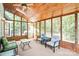 Screened-in porch featuring a wood plank ceiling and walls of windows overlooking the yard at 5238 Downing Creek Dr, Charlotte, NC 28269