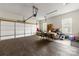 Spacious two car garage featuring vinyl plank flooring and overhead lighting at 5302 Fairgrove Ln, Harrisburg, NC 28075
