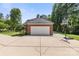 Attached two-car garage with an extended driveway and basketball hoop offers ample parking and recreational space at 5302 Fairgrove Ln, Harrisburg, NC 28075