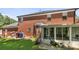 View of a sunroom and the backyard of a beautiful brick home at 5302 Fairgrove Ln, Harrisburg, NC 28075