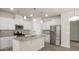 Modern kitchen with stainless steel appliances, granite countertops, and white cabinetry at 5337 Orchid Bloom Dr, Indian Land, SC 29707