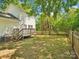 Backyard with wooden deck and fenced yard, offering privacy and outdoor enjoyment at 5828 Wilora Lake Rd, Charlotte, NC 28212