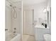This bathroom features a shower and bath combination, white walls, a sink and a toilet in a small area at 5828 Wilora Lake Rd, Charlotte, NC 28212
