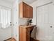 This at-home desk area features wood cabinets, drawers and a chair for a dedicated work-from-home space at 5828 Wilora Lake Rd, Charlotte, NC 28212
