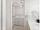 This small laundry room features a washer and dryer combination with white walls and modern fixtures at 5828 Wilora Lake Rd, Charlotte, NC 28212