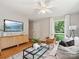 Bright living room features large windows, comfortable seating and modern decor for comfortable Gathering living at 5828 Wilora Lake Rd, Charlotte, NC 28212