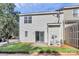 This townhome has a sliding glass door leading out to a grassy backyard at 5980 Cougar Ln, Charlotte, NC 28269