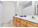 Bathroom featuring a double sink vanity, neutral color scheme, and ample counter space at 5980 Cougar Ln, Charlotte, NC 28269