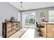 Sunny breakfast area with a slider, tile flooring and natural light at 5980 Cougar Ln, Charlotte, NC 28269