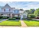 Inviting home with brick and siding, complemented by lush landscaping at 5980 Cougar Ln, Charlotte, NC 28269