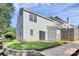 Exterior of the townhome shows private patio space and yard at 5980 Cougar Ln, Charlotte, NC 28269