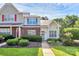 Charming townhome with manicured landscaping, walkway, and inviting entrance at 5980 Cougar Ln, Charlotte, NC 28269