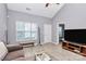 Cozy living room features vaulted ceilings, wood-look flooring, and ample natural light at 5980 Cougar Ln, Charlotte, NC 28269
