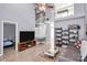 Open-concept living room boasts high ceilings, wood-look tile, and natural light at 5980 Cougar Ln, Charlotte, NC 28269