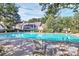 A community pool with lounge chairs offers a great place to relax by the water at 5980 Cougar Ln, Charlotte, NC 28269